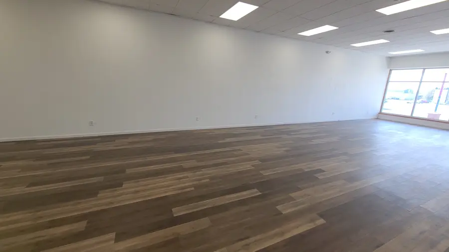The main room, floors down and walls painted, before anything else moved in