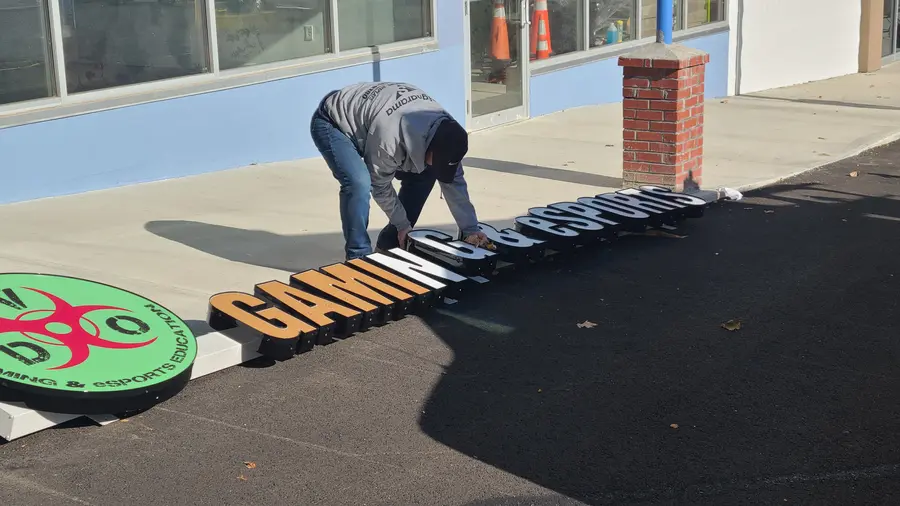 The storefront sign letters, laid out before going up on the wall