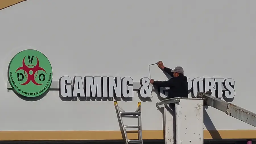The sign going up on the storefront