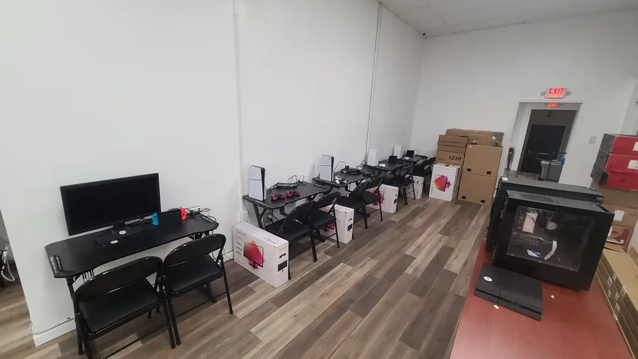 Consoles and monitors unboxed, ready to be set up