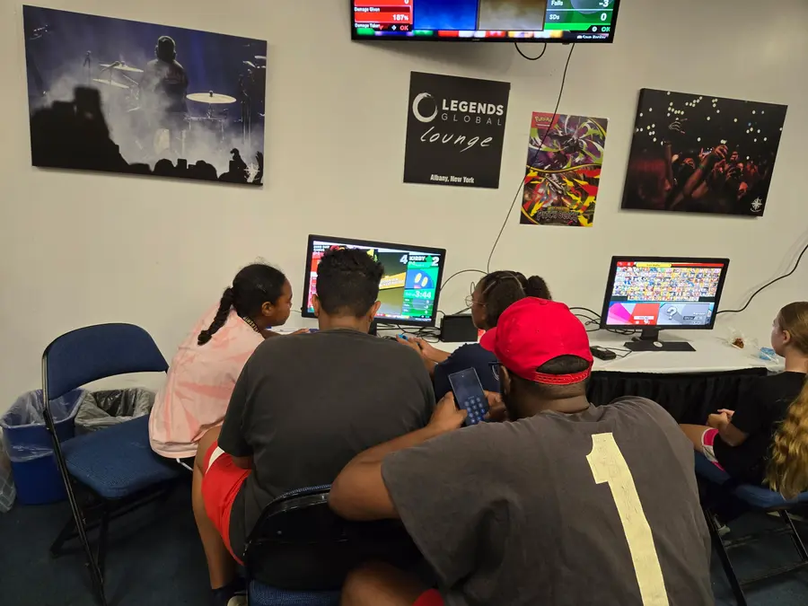 The family playing Super Smash Bros together