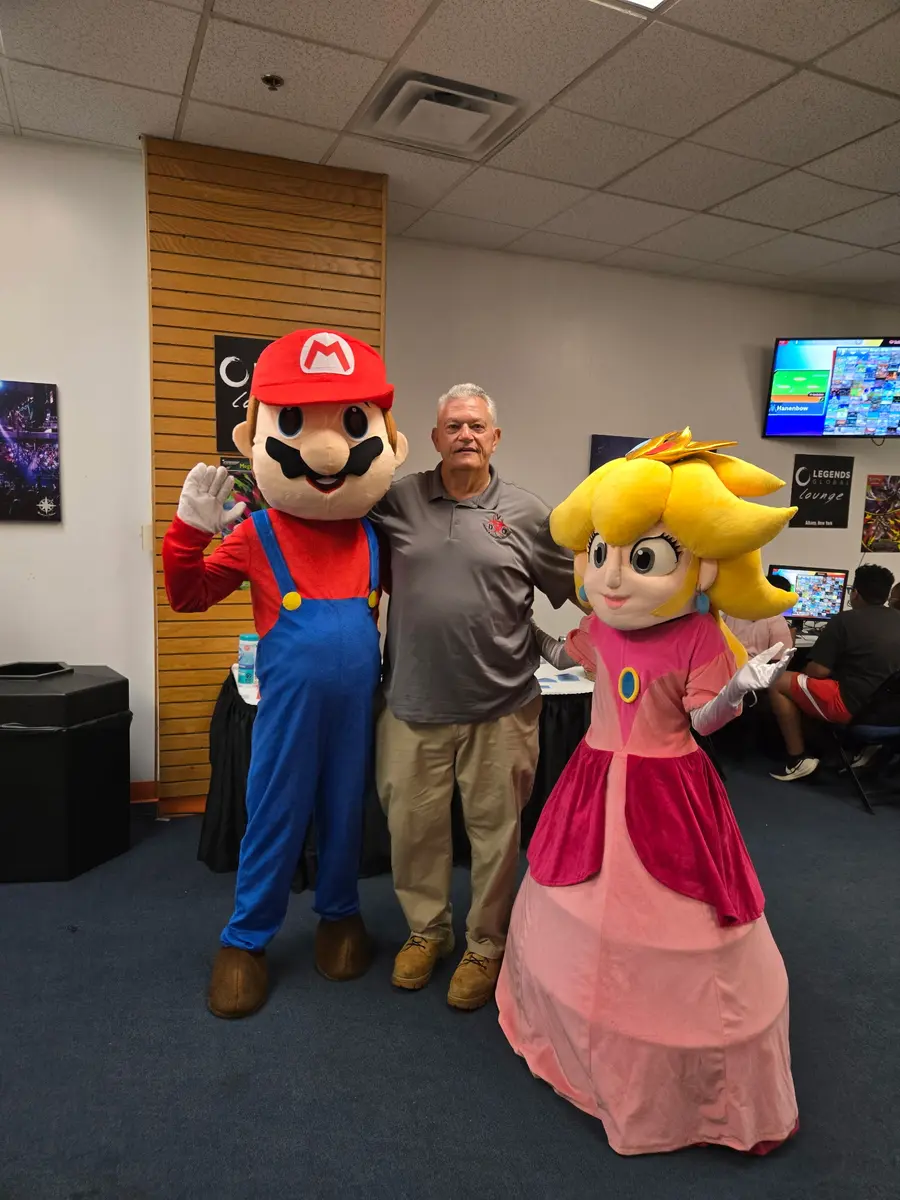 Posing with the Mario and Peach mascots